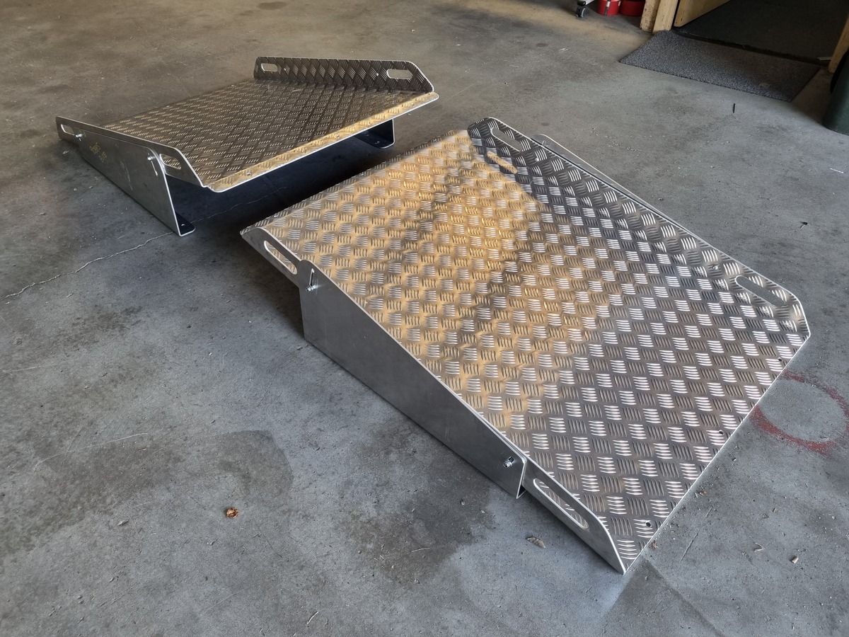 Custom adjustable aluminium ramp fabricated for food processing facility trolley access